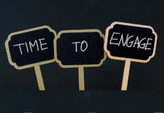3 signs that say "Time to Engage" written in chalk