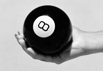 female holding Magic 8 ball to see the future of digital channels and business messaging