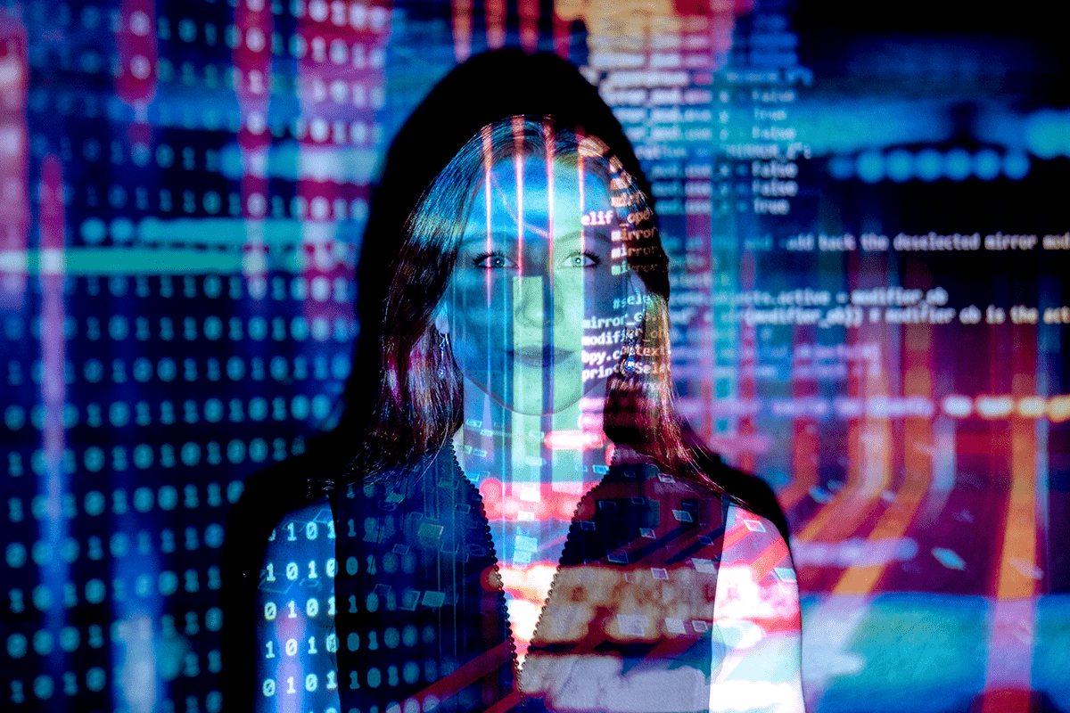 Lady with digital code reflecting onto her face